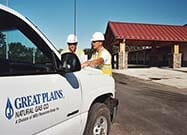 Employees standing by truck