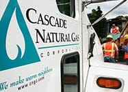 Employees standing by truck