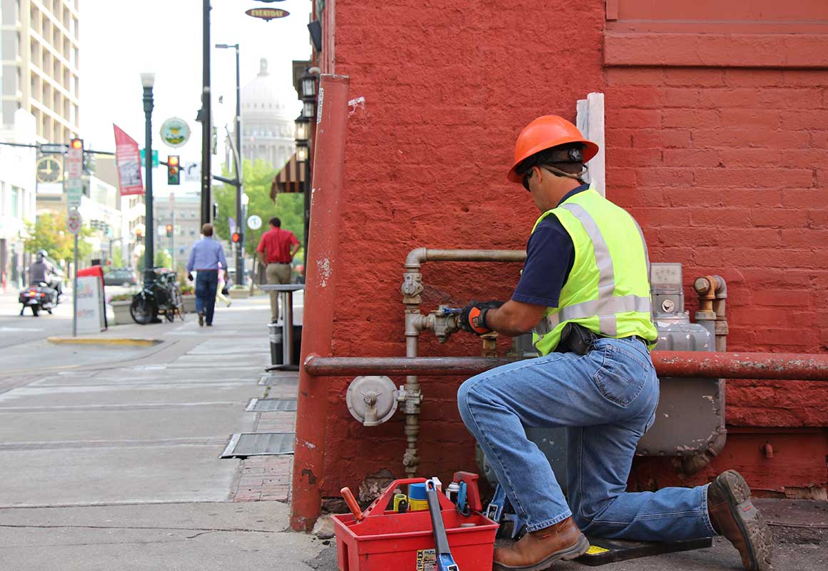 gas tech working on pipe