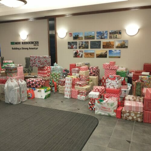 Employees purchase gifts for 57 families