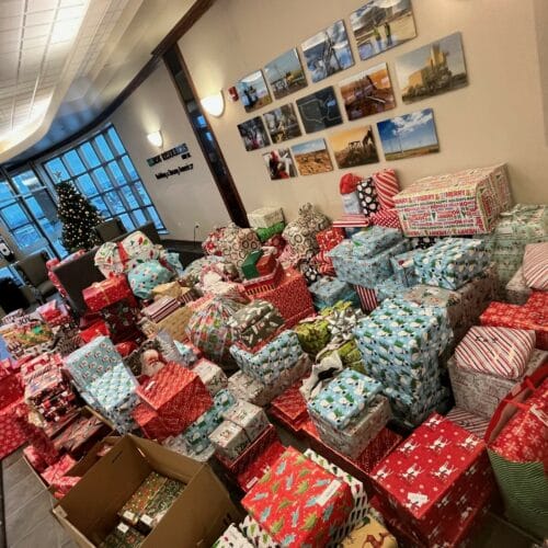Employees purchase gifts for 39 families