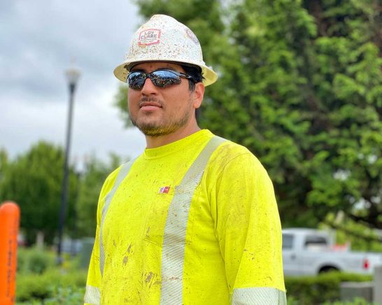 Construction employee looking into distance
